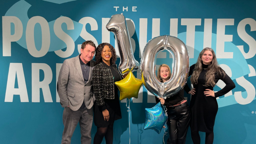 The Possibilities are Endless The Bee Social team pictured in the office with a 10 balloon